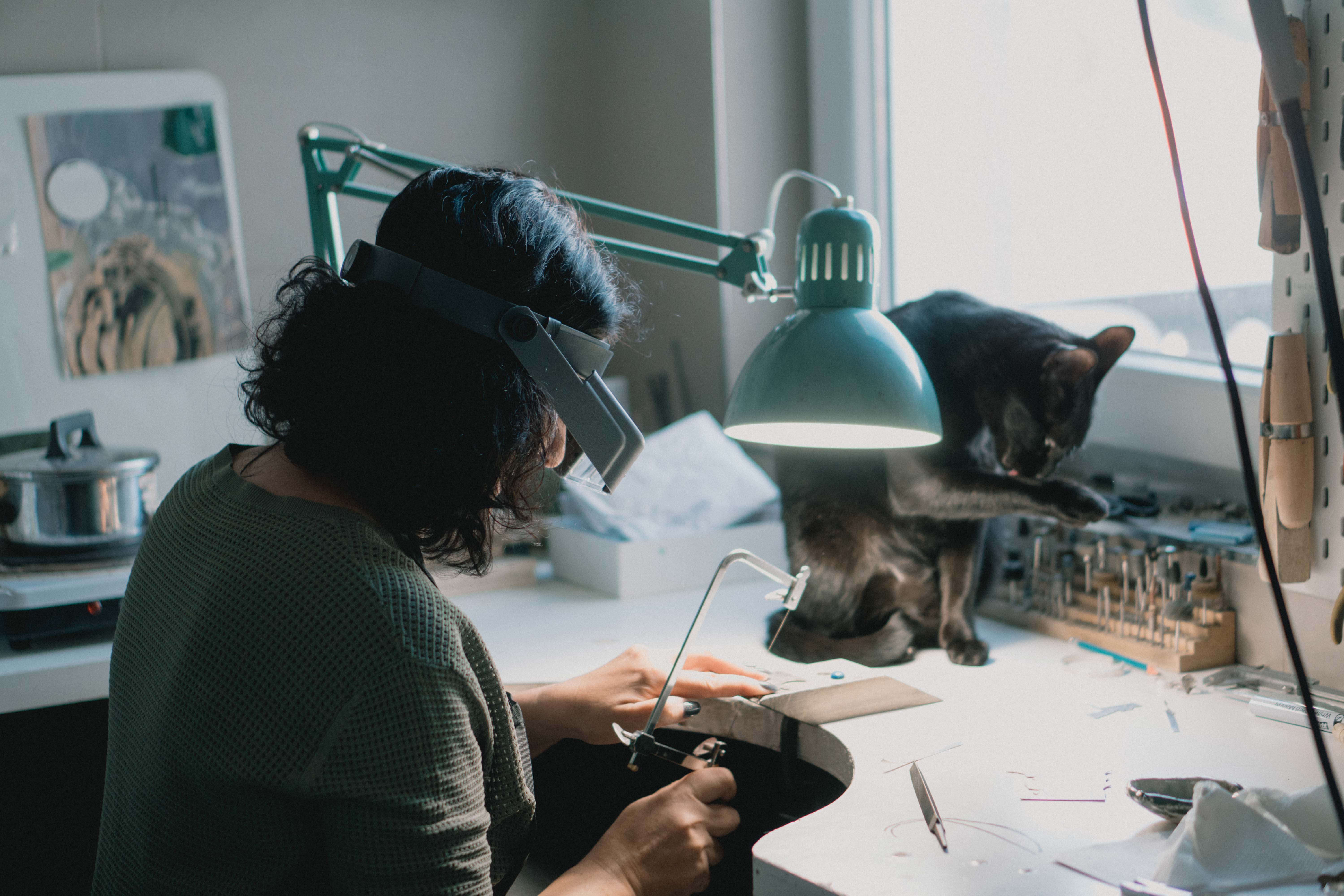 Sveta at work crafting handmade jewelry